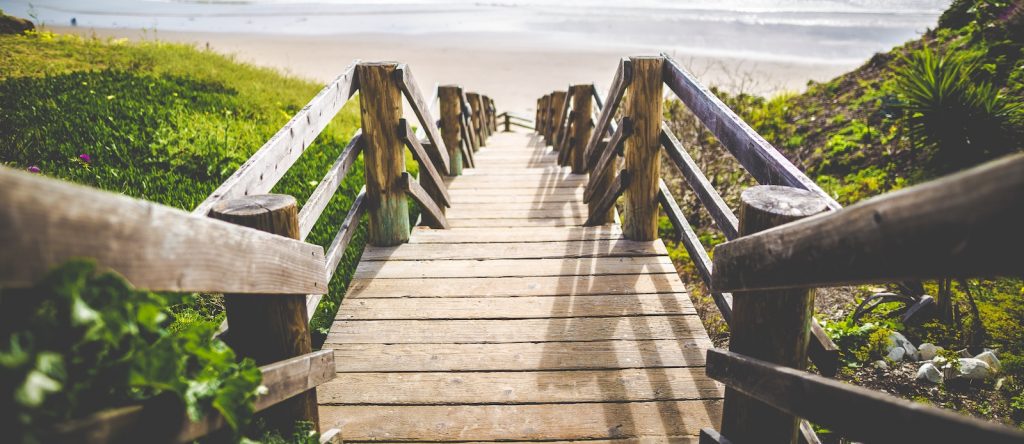 Path leading down stairs to the beach.