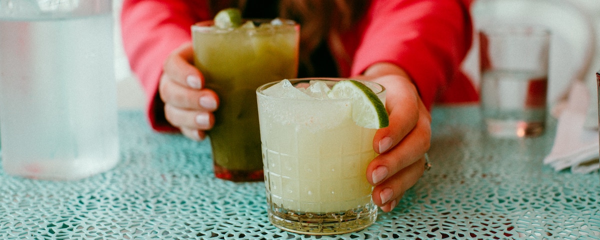 Woman holding lemonade, not a common side job anymore.