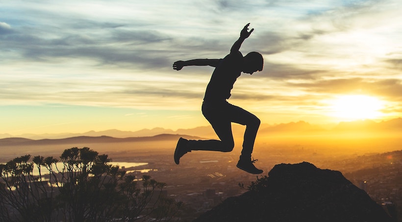 Man jumping while the sun is setting